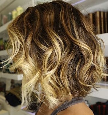 Blonde balayage hairstyle for wavy hair